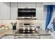 Modern kitchen with stainless steel appliances and gray cabinets at 5136 N 31St Pl # 648, Phoenix, AZ 85016