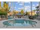 Relaxing community pool with surrounding lounge chairs at 5136 N 31St Pl # 648, Phoenix, AZ 85016
