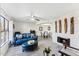 Open living room with fireplace, dining area, and blue sofa at 5136 N 31St Pl # 648, Phoenix, AZ 85016