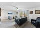 Bright living room with lake view, comfy seating, and wood-look floors at 5136 N 31St Pl # 648, Phoenix, AZ 85016