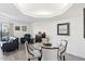 Small dining area with glass table and four chairs at 5136 N 31St Pl # 648, Phoenix, AZ 85016