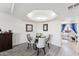 Bright dining area with glass table and view to kitchen at 5136 N 31St Pl # 648, Phoenix, AZ 85016