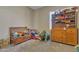 bedroom with wooden storage and lots of toys at 5532 E Santa Clara Dr, San Tan Valley, AZ 85140