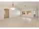 Bright and airy living room with tile flooring and large windows at 8737 W Kimberly Way, Peoria, AZ 85382