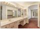 Bathroom with double sinks, and a large mirror at 8737 W Kimberly Way, Peoria, AZ 85382