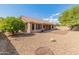 Spacious backyard with gravel landscaping and a patio at 8737 W Kimberly Way, Peoria, AZ 85382