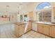Bright kitchen with island and tile floors at 8737 W Kimberly Way, Peoria, AZ 85382