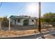 White single story home with teal accents at 1549 E Turquoise Ave, Phoenix, AZ 85020