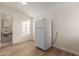 Kitchen with white refrigerator and light wood floors at 1549 E Turquoise Ave, Phoenix, AZ 85020