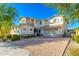 Two-story home with a landscaped front yard and brick driveway at 14674 W Pasadena Ave, Litchfield Park, AZ 85340