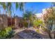 Landscaped backyard with desert plants, stone pathways, and bird bath at 7774 E Mariposa Dr, Scottsdale, AZ 85251