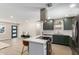 Updated kitchen features green shaker cabinets and a large island at 7508 E Beatrice St, Scottsdale, AZ 85257