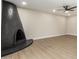 Large, black, curved fireplace in living room at 7508 E Beatrice St, Scottsdale, AZ 85257