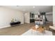 Open concept living and kitchen with modern decor and hardwood floors at 7508 E Beatrice St, Scottsdale, AZ 85257