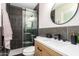 Modern bathroom with dark tile and floating vanity at 7508 E Beatrice St, Scottsdale, AZ 85257