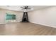 Living room features a wood-burning fireplace and sliding glass doors at 7508 E Beatrice St, Scottsdale, AZ 85257