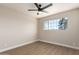Well-lit bedroom with ceiling fan and large window at 7508 E Beatrice St, Scottsdale, AZ 85257