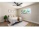 Spacious bedroom with ceiling fan and large window at 7508 E Beatrice St, Scottsdale, AZ 85257