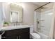 Modern bathroom with updated vanity, bathtub, and gold fixtures at 7508 E Beatrice St, Scottsdale, AZ 85257
