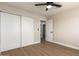 Bedroom with updated flooring and sliding door closet at 7508 E Beatrice St, Scottsdale, AZ 85257