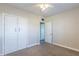 Bright bedroom with double door closet and ceiling fan at 702 E Dana Ave, Mesa, AZ 85204