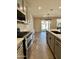 Modern kitchen with gray cabinets, stainless steel appliances, and an island at 10816 W Melvin St, Avondale, AZ 85323