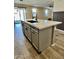Modern kitchen island with white quartz countertop and gray cabinets at 10816 W Melvin St, Avondale, AZ 85323