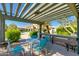 Relaxing covered patio with table and chairs at 16013 S Desert Foothills Pkwy # 1150, Phoenix, AZ 85048