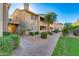 Attractive exterior of a condo building with landscaping and walkways at 16013 S Desert Foothills Pkwy # 1150, Phoenix, AZ 85048