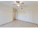 Bedroom with tile flooring, ceiling fan and access to bathroom at 16013 S Desert Foothills Pkwy # 1150, Phoenix, AZ 85048