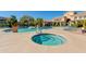 Community pool and spa with lounge chairs and patio area at 16013 S Desert Foothills Pkwy # 1150, Phoenix, AZ 85048