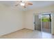 Spacious bedroom with tile flooring and sliding door to patio at 16013 S Desert Foothills Pkwy # 1150, Phoenix, AZ 85048