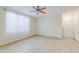 Bright living room with tile floors and large window at 16013 S Desert Foothills Pkwy # 1150, Phoenix, AZ 85048