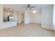 Open living room with kitchen and built-in shelving at 16013 S Desert Foothills Pkwy # 1150, Phoenix, AZ 85048