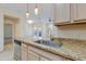 Kitchen boasts granite countertops and a breakfast bar at 16013 S Desert Foothills Pkwy # 1150, Phoenix, AZ 85048
