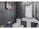 Modern powder room with dark crocodile print wallpaper and pedestal sink at 8536 E Preserve Way, Scottsdale, AZ 85266