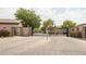 Gated community entrance with paved driveway at 846 N Pueblo Dr # 110, Casa Grande, AZ 85122