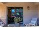 Covered patio with seating and sliding glass door leading inside at 846 N Pueblo Dr # 110, Casa Grande, AZ 85122