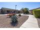 Landscaped community pathway with desert plants and building view at 846 N Pueblo Dr # 110, Casa Grande, AZ 85122