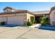 Tan two-car garage with front entry and landscaping at 846 N Pueblo Dr # 110, Casa Grande, AZ 85122