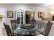 Bright dining area with glass table and four chairs at 846 N Pueblo Dr # 110, Casa Grande, AZ 85122