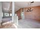 Bright dining room with a chandelier and views into the living room and kitchen at 2767 Leisure World --, Mesa, AZ 85206