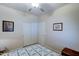 Well-lit bedroom with double door closet and ceiling fan at 2101 S Meridian Rd # 126, Apache Junction, AZ 85120