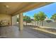 Covered patio with tile flooring, storage, and small trees at 2101 S Meridian Rd # 126, Apache Junction, AZ 85120