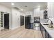 Modern kitchen with white and blue cabinets and quartz countertops at 1702 E Bell Rd # 106, Phoenix, AZ 85022