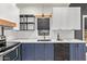 Modern kitchen with white and blue cabinets and a farmhouse sink at 1702 E Bell Rd # 106, Phoenix, AZ 85022