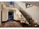 Grand staircase with ornate railing and patterned risers at 7835 N Ironwood Dr, Paradise Valley, AZ 85253