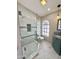 Updated bathroom with a large shower, tile flooring and modern vanity at 1922 E Yale St, Phoenix, AZ 85006