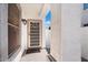 Front entry with decorative security door and lighting at 38169 N Rusty Ln, San Tan Valley, AZ 85140