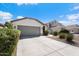 Single story house with attached garage and landscaping at 38169 N Rusty Ln, San Tan Valley, AZ 85140
